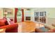 Living room with hardwood floors, fireplace, and sunroom access at 7507 Waxhaw Creek Rd, Waxhaw, NC 28173