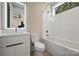 Modern bathroom with white hexagonal tile, a bathtub, and a floating vanity at 112 Frazier Ave, Charlotte, NC 28216