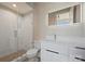 Clean bathroom with white vanity and herringbone tile shower at 112 Frazier Ave, Charlotte, NC 28216