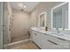 Elegant bathroom with double sinks, a walk-in shower, and modern fixtures at 112 Frazier Ave, Charlotte, NC 28216