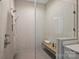 Spa-like shower with a built-in seat and hexagonal tile flooring at 112 Frazier Ave, Charlotte, NC 28216