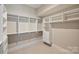 Large walk-in closet with ample shelving and drawers at 112 Frazier Ave, Charlotte, NC 28216