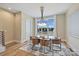 Bright dining room with a glass table and modern chandelier at 112 Frazier Ave, Charlotte, NC 28216