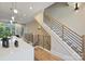 Modern staircase with metal and wood railings, leading to upper level at 112 Frazier Ave, Charlotte, NC 28216