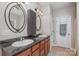 Double vanity bathroom with granite countertops and updated fixtures at 556 Peaceful Creek Dr, York, SC 29745