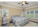 Bright bedroom with tray ceiling, hardwood floors, and ample natural light at 556 Peaceful Creek Dr, York, SC 29745