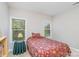 Bright bedroom with two windows and floral bedding at 556 Peaceful Creek Dr, York, SC 29745