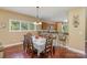 Bright dining room features a table with seating for six and hardwood floors at 556 Peaceful Creek Dr, York, SC 29745