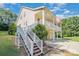 Two-story house with wrap-around porch, attached garage, and American flag at 556 Peaceful Creek Dr, York, SC 29745