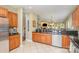 Spacious kitchen featuring granite countertops and ample wood cabinetry at 556 Peaceful Creek Dr, York, SC 29745