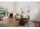 Dining area with round glass table and four chairs, located near living room at 35 Old Post Rd, Clover, SC 29710