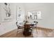 Small dining area with round glass-top table and four chairs at 35 Old Post Rd, Clover, SC 29710