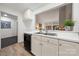 Bright kitchen features white cabinets, stainless steel sink, and view to living room at 35 Old Post Rd, Clover, SC 29710