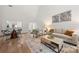 Bright living room with vaulted ceiling, hardwood floors, and neutral color palette at 35 Old Post Rd, Clover, SC 29710