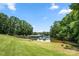 Landscaped lawn overlooking a calm lake and marina at 35 Old Post Rd, Clover, SC 29710