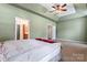 Spacious bedroom with neutral walls and carpet, featuring an ensuite bathroom at 6801 Cinnamon Cir, Mint Hill, NC 28227