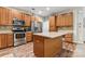 Kitchen with wood cabinets, stainless steel appliances and island at 6801 Cinnamon Cir, Mint Hill, NC 28227