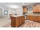 Kitchen with island, wood cabinets, and tiled backsplash at 6801 Cinnamon Cir, Mint Hill, NC 28227