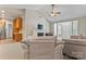 Living room with vaulted ceiling, fireplace, and kitchen access at 6801 Cinnamon Cir, Mint Hill, NC 28227