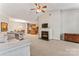 Spacious living room featuring a fireplace and kitchen view at 6801 Cinnamon Cir, Mint Hill, NC 28227