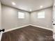 Simple bedroom with dark hardwood floors and neutral walls at 4230 Northaven Dr, Charlotte, NC 28206