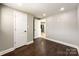 Spacious bedroom with hardwood floors and two doors at 4230 Northaven Dr, Charlotte, NC 28206