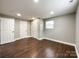 Bedroom with hardwood floors, double-door closet, and window at 4230 Northaven Dr, Charlotte, NC 28206