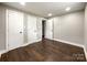 Bedroom with hardwood floors and neutral walls, closets and access to hallway at 4230 Northaven Dr, Charlotte, NC 28206