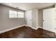 Bedroom with hardwood floors, window, and closet at 4230 Northaven Dr, Charlotte, NC 28206