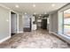 Open concept dining area with tile floors adjacent to the kitchen and Gathering room at 4230 Northaven Dr, Charlotte, NC 28206