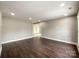 Living room with dark hardwood floors and recessed lighting at 4230 Northaven Dr, Charlotte, NC 28206