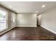 Spacious living room featuring hardwood floors, neutral walls, and ample natural light at 4230 Northaven Dr, Charlotte, NC 28206