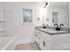 Bathroom features a double sink vanity with granite counters and white cabinets at 6169 Long Branch Rd, Salisbury, NC 28147