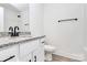 Granite counters accent this bathroom featuring a white sink and modern black faucet, with a matching black towel bar at 6169 Long Branch Rd, Salisbury, NC 28147