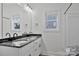 Elegant bathroom featuring double vanity with dark countertops, offering style and functionality at 6169 Long Branch Rd, Salisbury, NC 28147