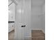 Bathroom entrance into walk-in closet and vanity featuring modern fixtures and a wire rack at 6169 Long Branch Rd, Salisbury, NC 28147