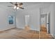 Well-lit bedroom with a ceiling fan, connecting to the bathroom and walk-in closet, offering style and functionality at 6169 Long Branch Rd, Salisbury, NC 28147