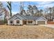 Charming single-story home featuring neutral siding, a gabled roof, and an attached garage at 6169 Long Branch Rd, Salisbury, NC 28147