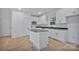 Elegant kitchen featuring white cabinets, a center island, and modern appliances at 6169 Long Branch Rd, Salisbury, NC 28147