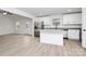 Kitchen with island and stainless steel refrigerator in an open floor plan, offering modern design at 6169 Long Branch Rd, Salisbury, NC 28147