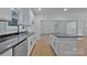 Well-lit kitchen with stainless steel appliances, a center island, and granite countertops at 6169 Long Branch Rd, Salisbury, NC 28147