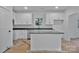 Stylish kitchen with white cabinetry, a center island, and sleek granite countertops at 6169 Long Branch Rd, Salisbury, NC 28147