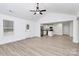 A bright and airy living room transitions into a modern kitchen with stainless steel appliances and an island at 6169 Long Branch Rd, Salisbury, NC 28147