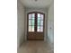 Elegant entryway featuring arched double doors with glass panels, providing natural light and inviting access to the home at 1500 Crowders Creek Rd, Gastonia, NC 28052