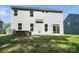 Backyard view of a two-story home with a gray exterior and sliding glass doors at 2024 Cedar Falls Dr # 9, Waxhaw, NC 28173