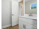 Bright bathroom with a white vanity, modern fixtures, and a view to the hallway at 2024 Cedar Falls Dr # 9, Waxhaw, NC 28173
