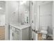Bathroom with a white vanity, and an open doorway to a toilet and a view into the hallway at 2024 Cedar Falls Dr # 9, Waxhaw, NC 28173
