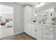 Bright bathroom with a large white vanity, modern fixtures, and a view into the bedroom at 2024 Cedar Falls Dr # 9, Waxhaw, NC 28173
