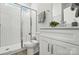 Bright bathroom featuring white subway tile in the glass-enclosed shower and a modern vanity with white cabinets at 2024 Cedar Falls Dr # 9, Waxhaw, NC 28173