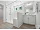 Bright bathroom featuring a spacious shower with a glass enclosure, subway tile, and a gray wood-look tile floor at 2024 Cedar Falls Dr # 9, Waxhaw, NC 28173
